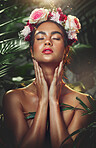 Woman flower crown, skincare beauty and jungle leaves in nature with makeup, cosmetics and glow skin. Model, girl and flowers on head, cosmetic shine of face or wreath bouquet on hair in forest trees
