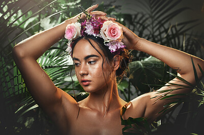 Buy stock photo Beauty, forest and face of a woman with a flower crown standing by a tropical leaf background. Cosmetics, skincare and model from Mexico with a wellness skin routine with green plants in nature.