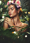 Nature, beauty and woman with skincare for wellness, cosmetic health or body healthcare grooming. Flower, plant and face of dermatology model relax with advertising for natural facial or skin product