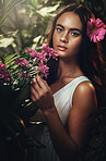 Beauty, flowers and woman in studio for skincare, makeup and product from nature, wellness and leaf cosmetics. Portrait, flower and girl model with jungle, plant and zen, relax and peony aesthetic