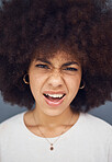 Confused, afro and face of a woman thinking of a decision against a grey studio background. Doubt, uncertain and portrait head of a young girl looking puzzled, doubtful and with a facial reaction