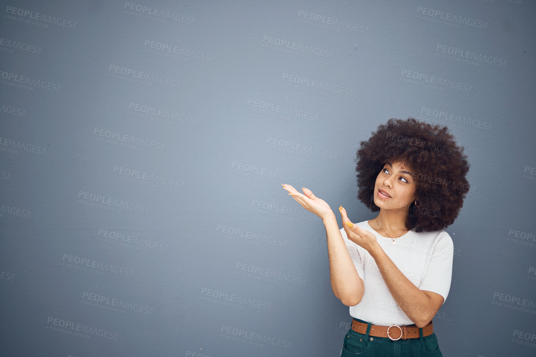 Buy stock photo Afro woman, showing hands and advertising space on grey studio background for marketing mockup, creative deal or mock up design. Brazilian model, pointing and promotion at gray backdrop for branding