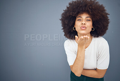 Buy stock photo Blow kiss, black woman and mockup showing love, smile and happy kissing with beauty. Model from New York with natural hair, happiness and mock up space loving romance and skincare wellness in studio