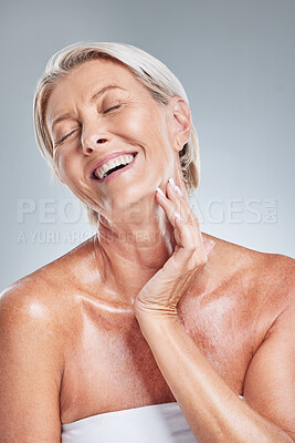 Buy stock photo Happy, senior woman and skincare in studio for cleaning, grooming and wellness on a grey background mockup. Skin, relax and elderly model laugh, enjoy and relax with wrinkles, beauty and treatment