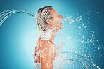 Water splash, laughing and model woman happy about wellness, water and skin beauty. Happiness of a person with happiness, healthy skincare routine and shower ready for the morning with a smile