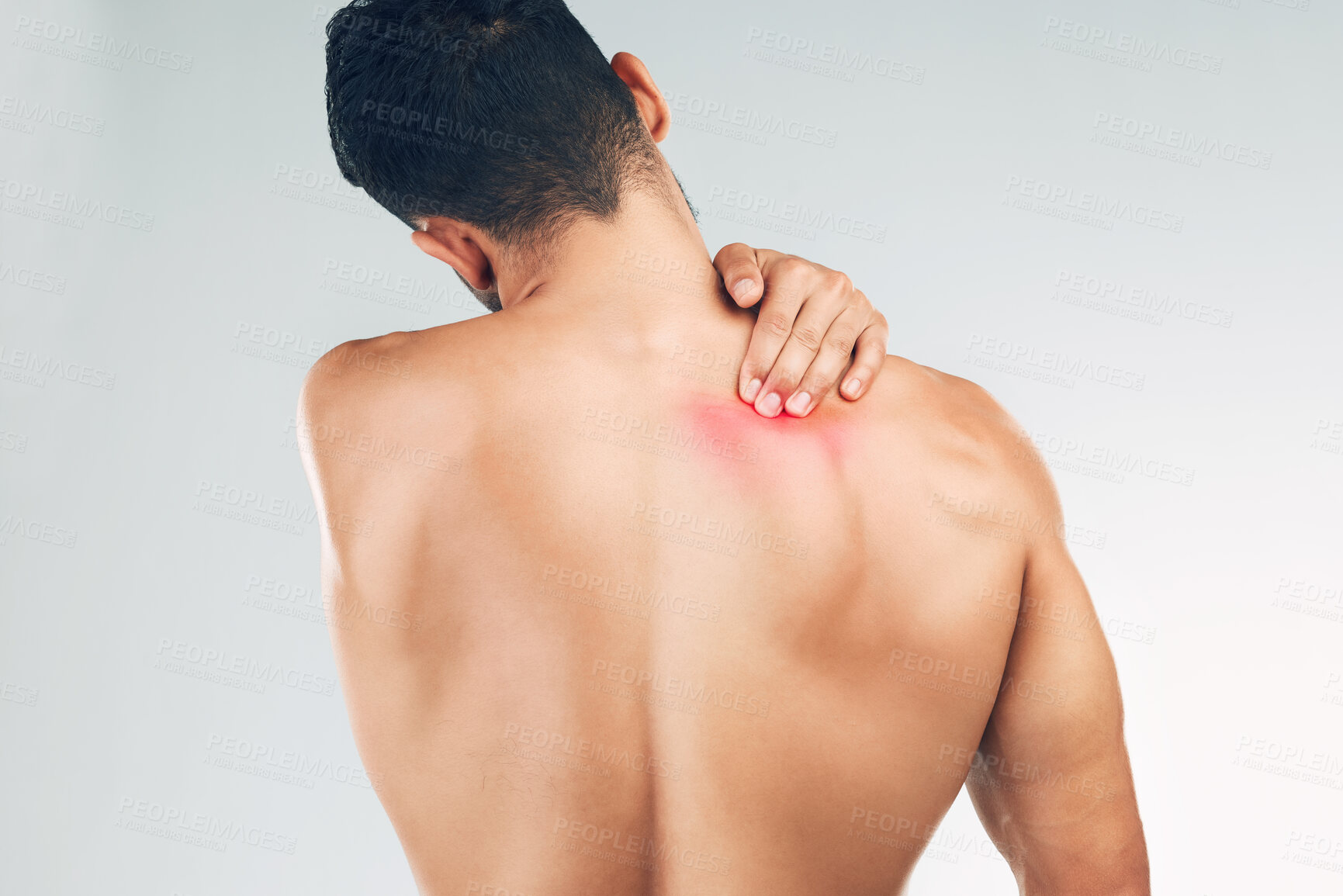 Buy stock photo Back pain, injury and man with medical problem, tension and stress against grey mockup studio background. Back of a person with a body symptom, inflammation and muscle pain with mock up space