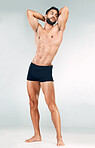 Muscle, strong and body of a man for fitness, health and motivation for goal against grey mockup studio background. Thinking, sports and bodybuilder model with sexy, young and healthy abs from sports