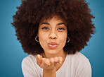 Woman model, fashion and blow kiss for beauty, makeup and empowerment in skincare and afro hair. Headshot portrait of creative young brazilian girl or happy black person in blue studio background