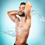 Wellness, water splash and body beauty man with health, muscle and clean skin hygiene marketing. Cleaning, pure and male model enjoying skincare wash with blue studio gradient and mockup.

