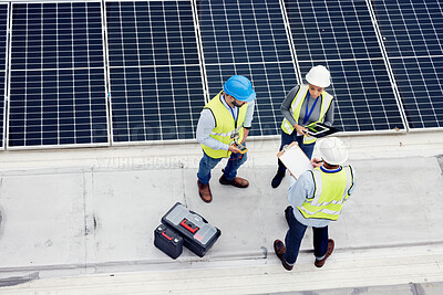 Buy stock photo Engineering, solar panel and top view of team in discussion for inspection or installation. Sustainable, clean and solar energy from photovoltaic cells with industry people in collaboration on a site
