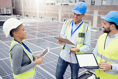 Buy stock photo Teamwork, planning and employees in solar panel industry for installation, renewable energy and engineering with a tablet. Meeting, construction and engineers talking about solar energy on a roof