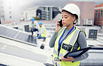 Engineer woman talking with phone, solar energy on roof and sustainable renewable energy in construction. Building manager, working with eco friendly solar panel or electricity maintenance project