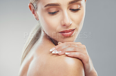 Buy stock photo Skincare, glow and woman with cosmetic beauty, wellness and care against a grey studio background. Shoulder, spa and girl model with self love, confidence and natural dermatology for young skin