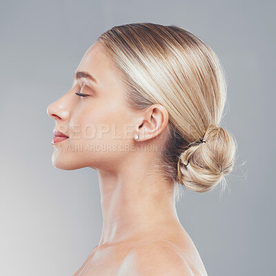 Buy stock photo Face, beauty and skincare with the profile of a woman in studio on a gray background for wellness or treatment. Luxury, wellness and cosmetics with a model female posing to promote a natural product