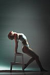 Dance, chair and woman doing a performance in a studio for training or a concert with mockup space. Sexy, entertainment and girl dancing or moving for a theater show isolated by a gradient background