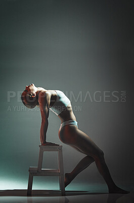 Buy stock photo Dance, chair and woman doing a performance in a studio for training or a concert with mockup space. Sexy, entertainment and girl dancing or moving for a theater show isolated by a gradient background