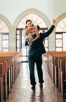 Celebration, carrying and man with bride after wedding in a church, happy and smile for marriage event. Love, comic and couple walking in a building after getting married to celebrate together