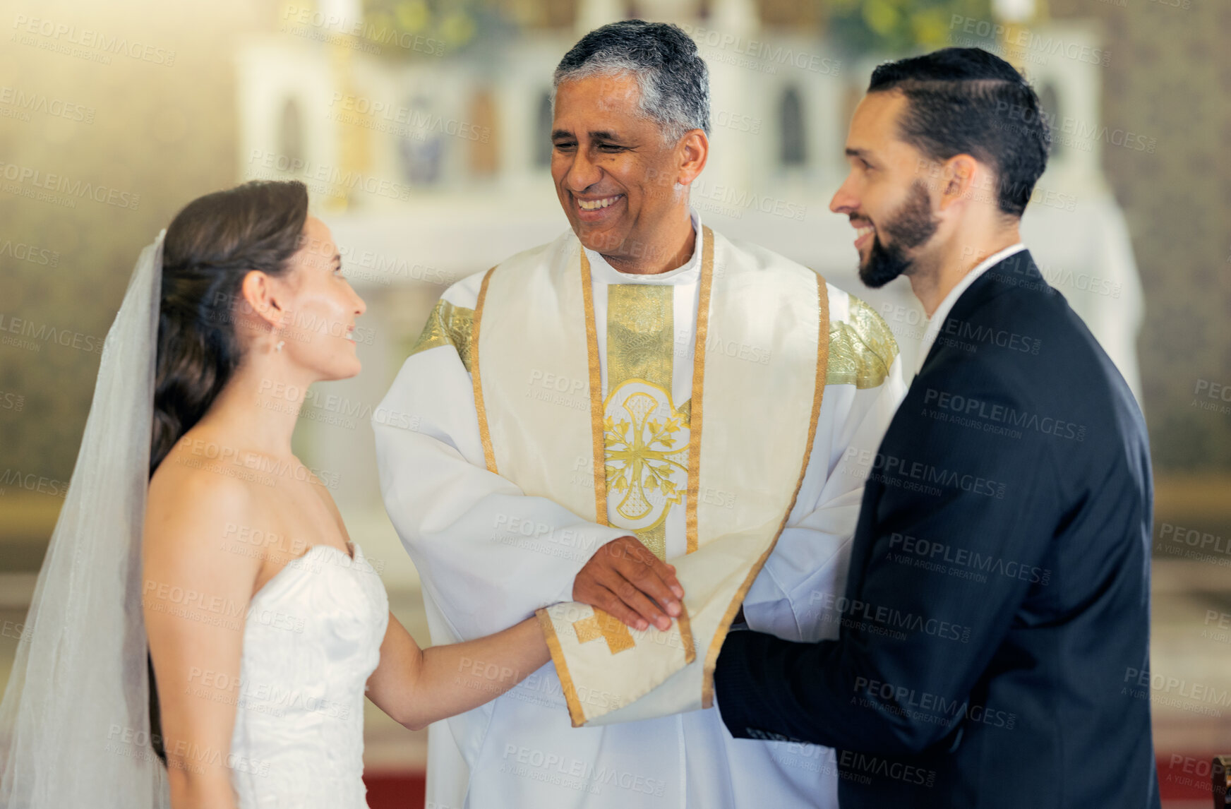 Buy stock photo Wedding, priest and couple holding hands in church for a christian marriage oath and faithful commitment. Trust, bride and happy groom with a supportive pastor helping them make a holy love promise 