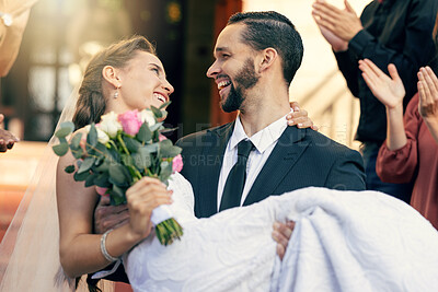 Buy stock photo Love, wedding and man carrying woman at church after marriage ceremony with applause of friends and family. Happy, smile and celebration of married bride and groom after event with audience clapping.
