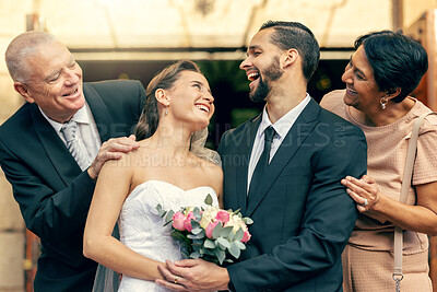 Buy stock photo Wedding, happy and couple with parents at a celebration of love at an event with happiness. Smile, celebrate and young bride and groom after marriage with mother and father together at a church