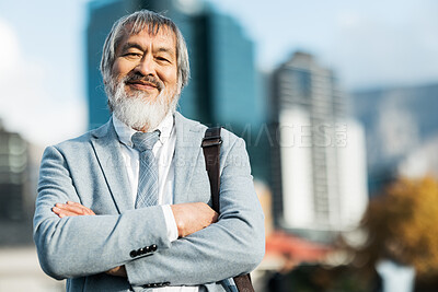 Buy stock photo Mature asian businessman, portrait and proud man in the city during a commute or journey to work. City background, executive businessperson and arms crossed while leading on an urban background