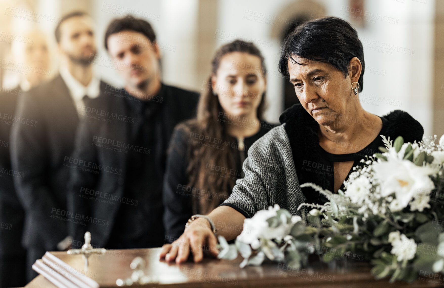 Buy stock photo Funeral, death and coffin in church or Christian family gathering together for support. Religion, sad people and mourning loss or religious catholic men and women grief in church service over casket