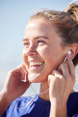 Buy stock photo Fitness, earphones and happy woman listening to music while doing an outdoor workout in Australia. Happiness, smile and girl training outside while streaming radio, audio or podcast for motivation.