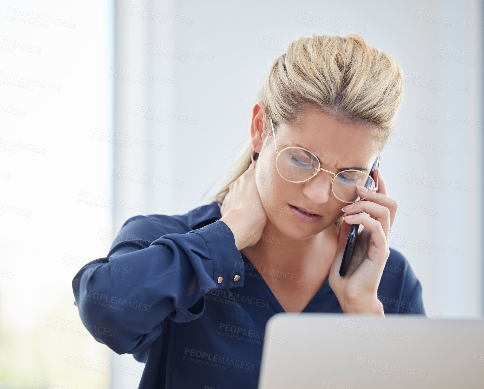 Buy stock photo Phone call, neck pain and business woman with stress while working on a project with her laptop. Exhausted, stressed and professional employee on a mobile conversation with a smartphone in the office