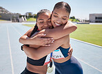 Fitness, success and runner hug winner after marathon race on a running track, happy, excited and congratulations. Sports, friends and women embrace in support of achievement, performance and goal