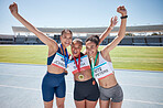 Woman, friends and winner in running sport for medal, marathon or athletics at the stadium track outdoors. Group of women in celebration for victory run, achievement or win in athletic sports outside