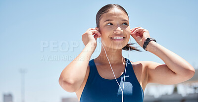 Buy stock photo Music, fitness and woman in a city for exercise, training and running while listening to radio, track and audio motivation. Podcast, runner and black woman happy, smile and relax before workout