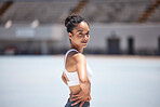 Woman, athlete and fitness in an outdoor stadium happy about exercise, training and run. Portrait of a black woman runner with a smile with happiness of health workout and sport goals outdoor