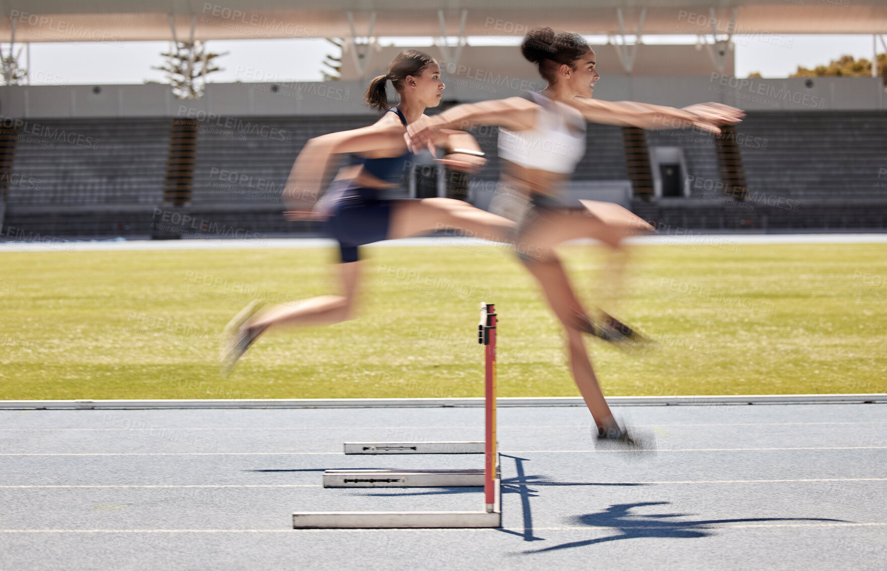 Buy stock photo Fitness, race and hurdles with a black woman and sports athlete racing on a track for endurance competition. Motion blur, energy or running with a female and rival or competitor jumping over a hurdle