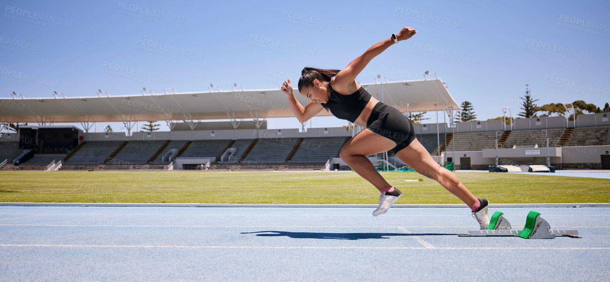 Buy stock photo Fitness, start and running with woman in stadium for sports, training and marathon on race track. Fast, action and cardio with runner of competition field for speed, energy and endurance performance