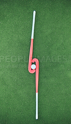 Buy stock photo Hockey, sticks and ball on turf grass at a stadium for a sports match, exercise or training. Fitness, workout and sport equipment on outdoor field for championship game, practice or skill development
