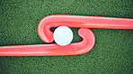 Hockey, ball and stick on green field, pitch and equipment against grass background after game, competition and match. Sports equipment, top view and astroturf with in practice, training and sport