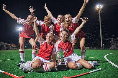 Buy stock photo Soccer, trophy and women on a field at night to celebrate teamwork, winning and sports. Football, winner and portrait of team of people with a smile during celebration of achievement and award