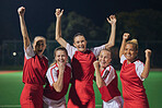 Soccer, winning team, and women celebrate win and teamwork on soccer field. Success, sports and proud girls in group portrait together, winner football team from Brazil on grass at night soccer game.