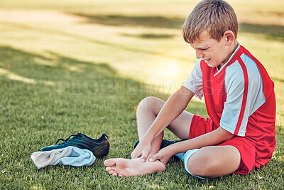 Buy stock photo Soccer, injury and pain of child foot on field cry for medical emergency, healthcare insurance and wellness. Football, soccer field and sad kid crying with legs massage for sports training accident