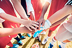 Hands, team and soccer in support, trust and collaboration for diversity in sports on a field in the outdoor. Hand, football and teamwork connect together in motivation, support or plan to win game