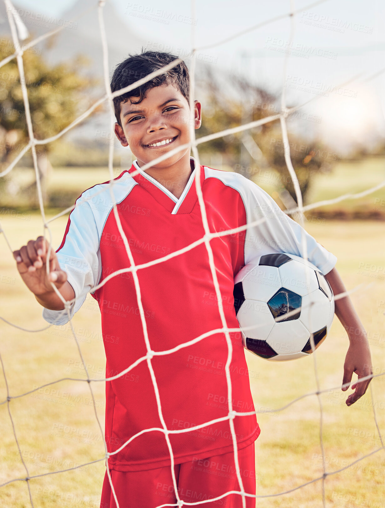 Buy stock photo Children, fitness and soccer by boy on soccer field for sports, training and exercise, happy and excited. Kids, sport and football by portrait of young indian football player ready for workout match