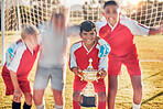 Trophy, soccer and team in celebration of success as winners of a sports award in a childrens youth tournament. Happy, goals and young soccer players celebrate winning a kids football championship 