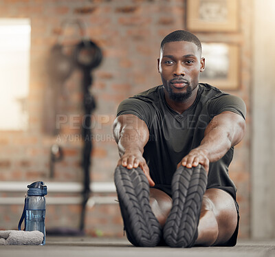 Black man, stretching and fitness in gym workout, training and exercise with health goals, motivation or wellness target. Bodybuilder, sports athlete or personal trainer in warmup for muscle relief