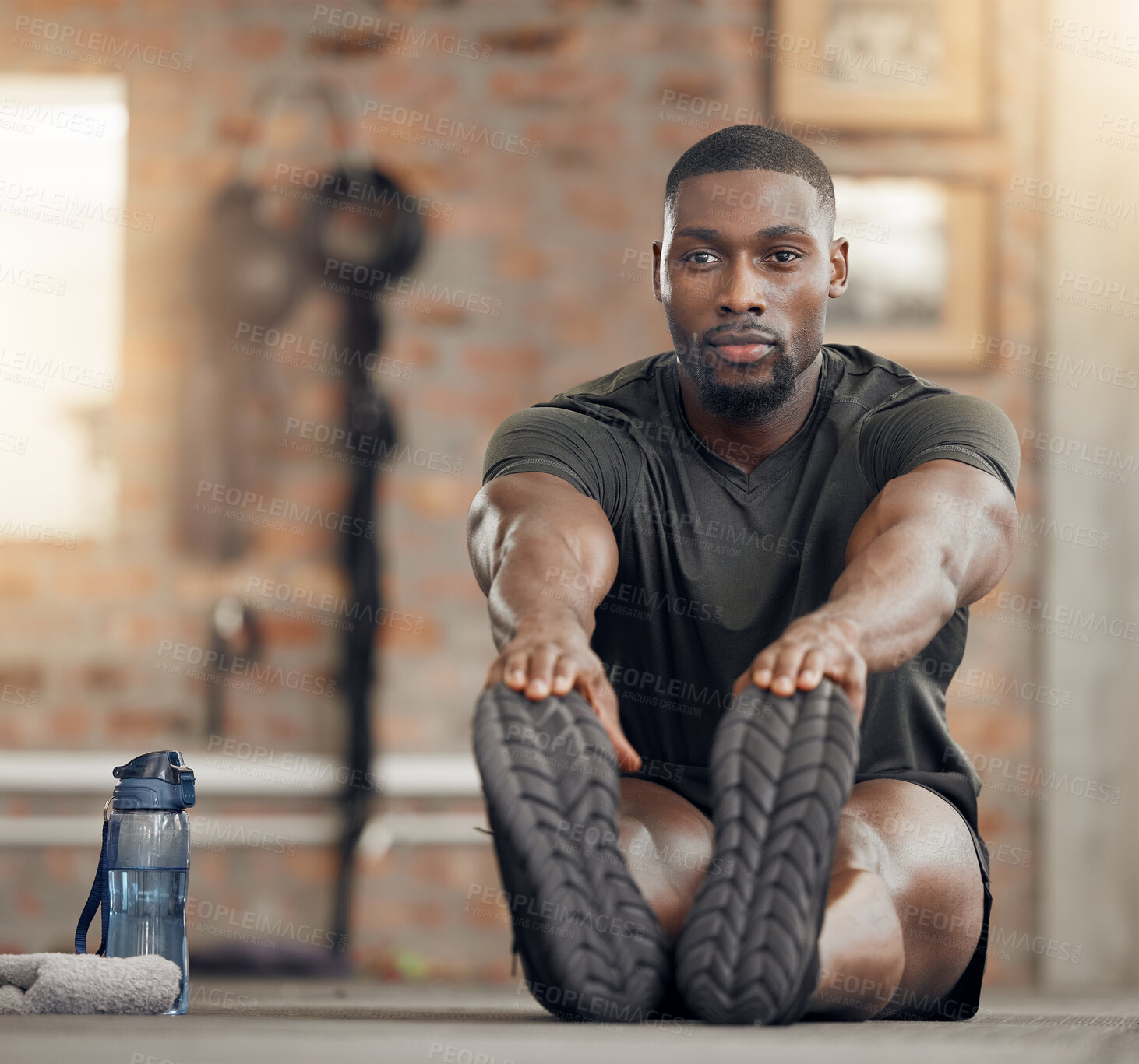 Buy stock photo Black man, stretching and fitness in gym workout, training and exercise with health goals, motivation or wellness target. Bodybuilder, sports athlete or personal trainer in warmup for muscle relief