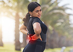 Red, back pain and woman fitness in park or city for exercise, running or workout healthcare with burnout, stress and body risk of arthritis. Tired, injury and sports person or runner with spine pain