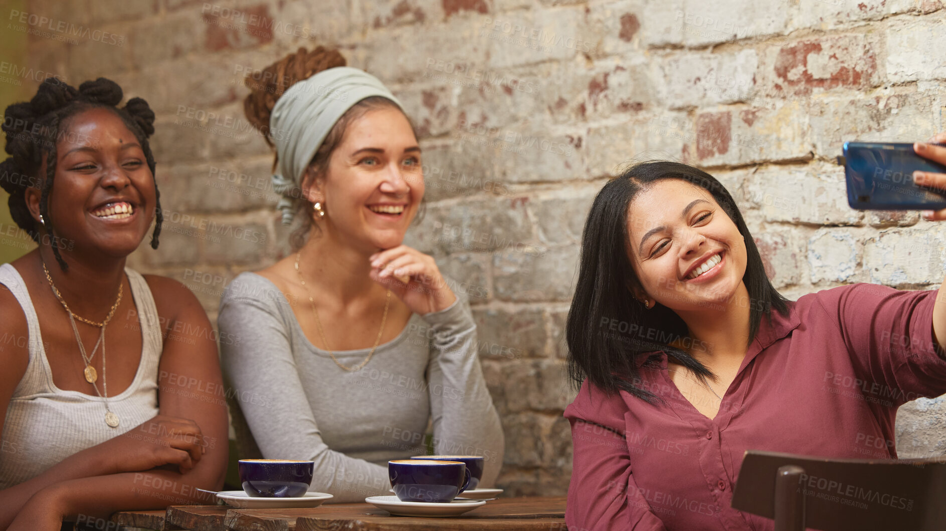 Buy stock photo Selfie, coffee and friends at a cafe for a reunion, happy and being funny together. Coffee shop, comic and diversity with women and a photo on a phone for social media, live streaming or mobile app