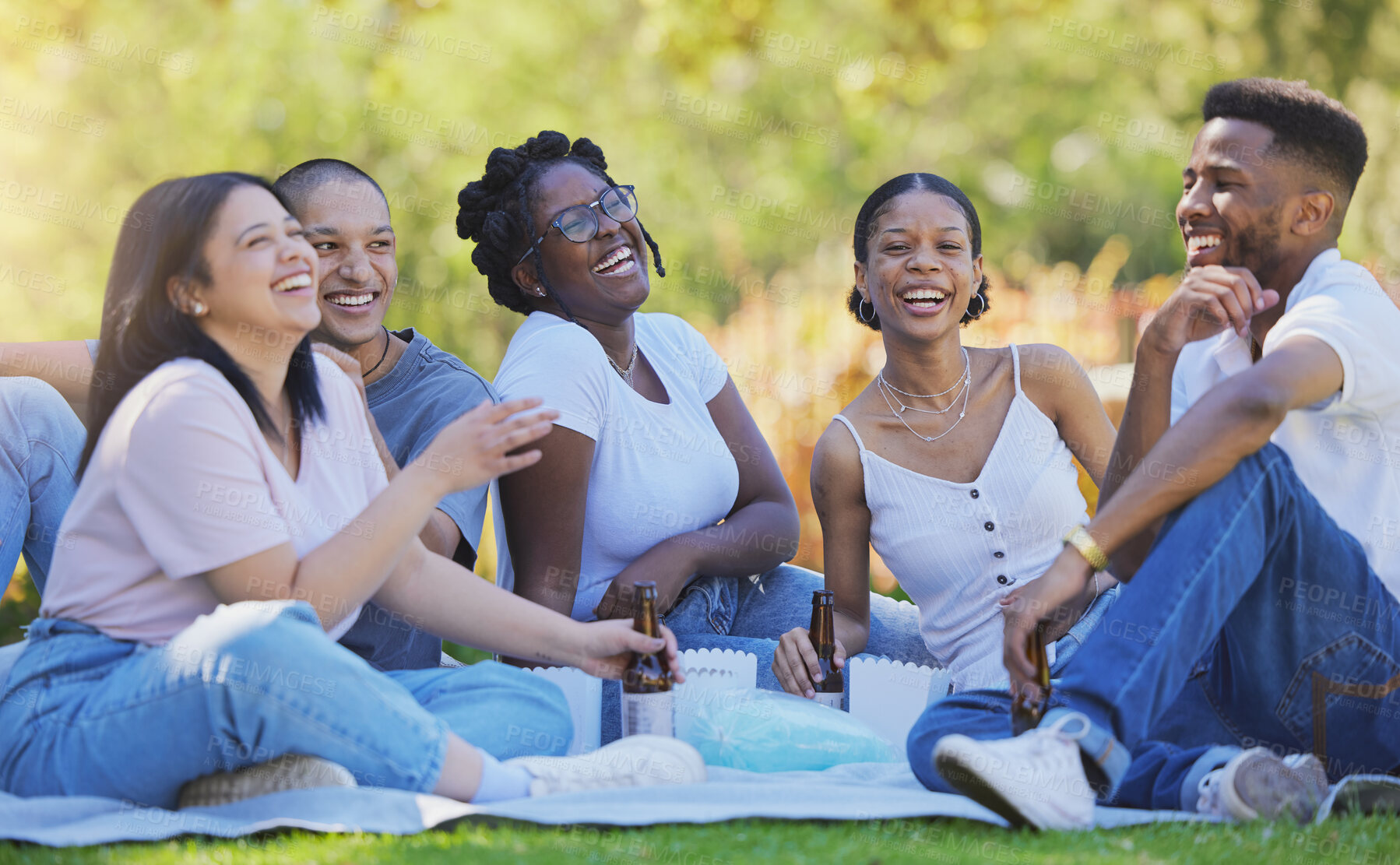 Buy stock photo Friends, funny and outdoor picnic in park, laugh at comedy with fun together and beer with food out in nature. Happiness, comic and diversity in friendship, men and women bonding and laughing.