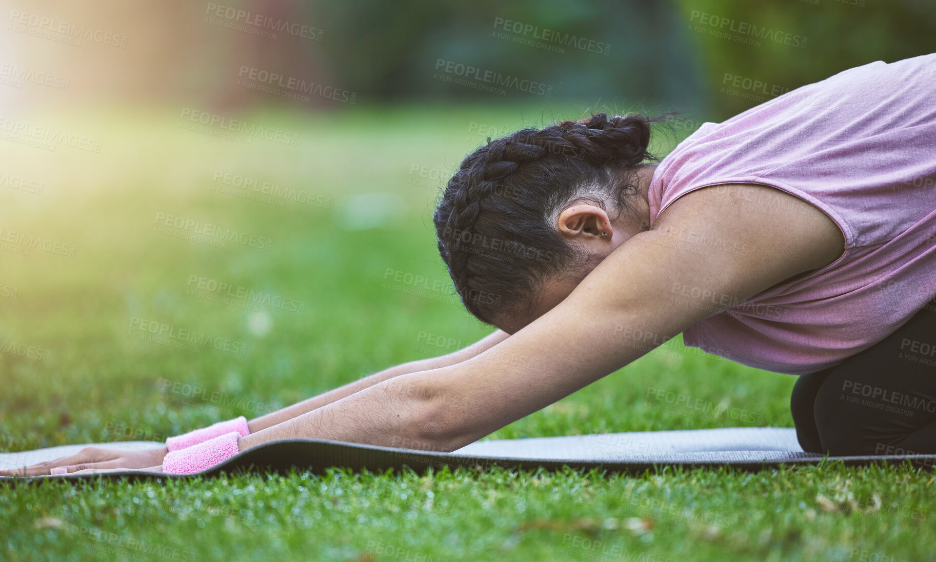 Buy stock photo Yoga, exercise and nature with woman doing wellness exercise for health, zen and peace while on a mat for fitness. Girl on grass for meditation, training or pilates workout at a park in summer