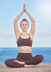 Yoga, beach and healthy woman outdoor for meditation, exercise and workout for health, wellness and freedom for mindfulness, zen and peace. Model with hands in air by nature sea for fitness breathing