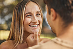 Love, man touching woman chin for happiness, intimacy and bonding being loving, happy or smile together. Romance, couple or connect for relationship for quality time, passionate or embrace on holiday